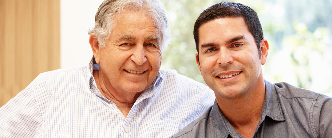 Father and son smiling together